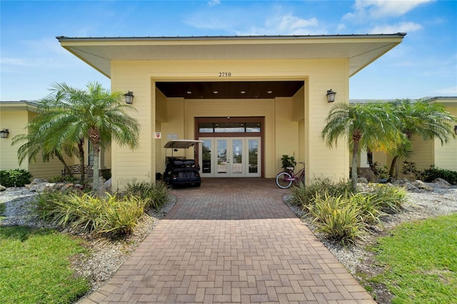 view of exterior entry featuring french doors
