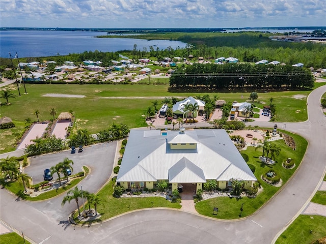 birds eye view of property with a residential view and a water view