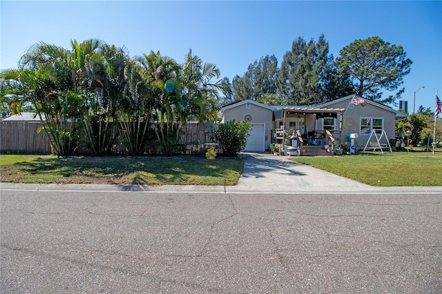 2132 40th Ave N, Saint Petersburg, FL 33714 - view of front facade with concrete driveway, an attached garage, and a porch