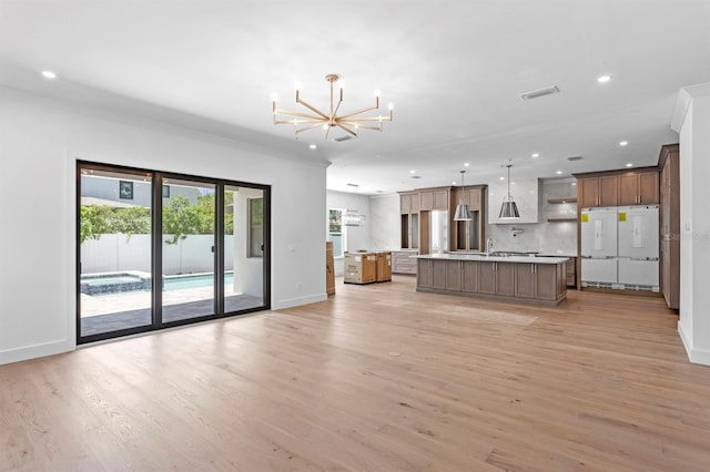 3406 W Alline Ave, Tampa, FL 33611 - unfurnished living room with a chandelier, baseboards, recessed lighting, light wood-type flooring, and ornamental molding