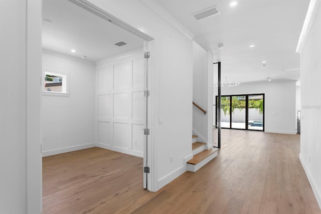 3406 W Alline Ave, Tampa, FL 33611 - hall featuring light wood finished floors, recessed lighting, stairway, and baseboards
