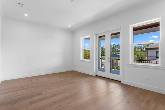 3406 W Alline Ave, Tampa, FL 33611 - unfurnished room with ornamental molding, wood finished floors, baseboards, french doors, and recessed lighting