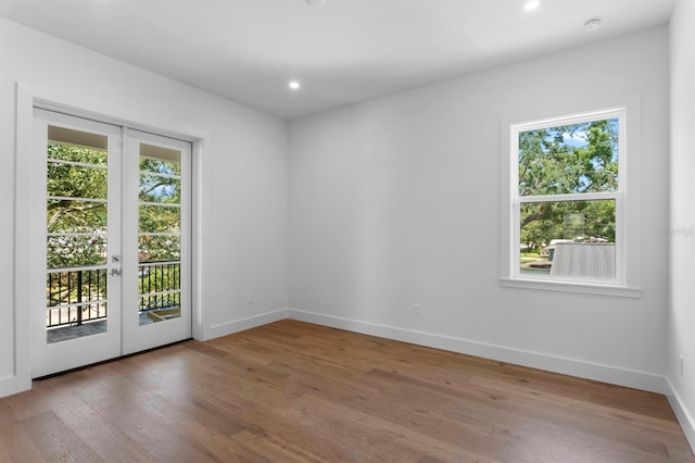 3406 W Alline Ave, Tampa, FL 33611 - spare room with french doors, wood finished floors, baseboards, and recessed lighting