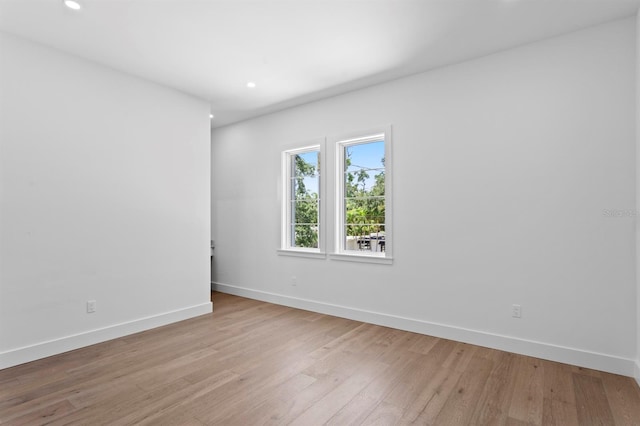 3406 W Alline Ave, Tampa, FL 33611 - unfurnished room with baseboards, light wood-style floors, and recessed lighting