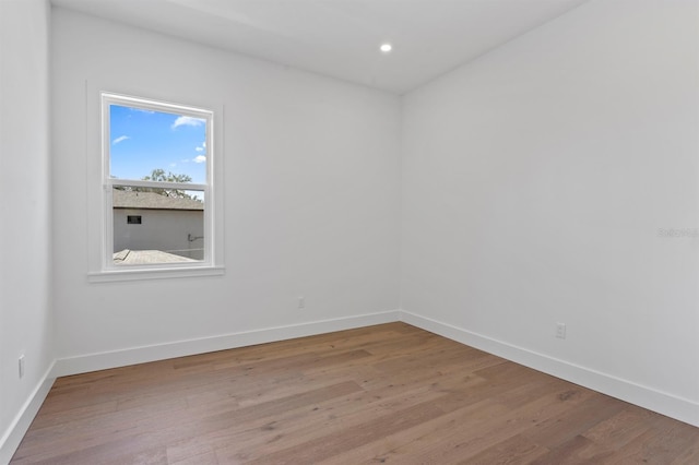 3406 W Alline Ave, Tampa, FL 33611 - empty room featuring light wood-style floors, baseboards, and recessed lighting