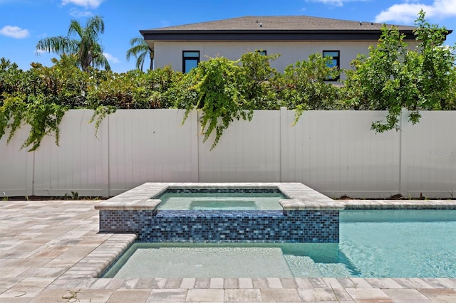 3406 W Alline Ave, Tampa, FL 33611 - view of pool with a fenced backyard, a patio, and a pool with connected hot tub