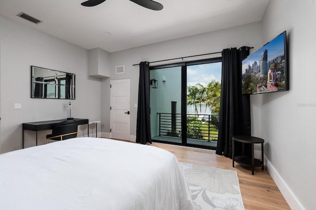 bedroom featuring visible vents, light wood finished floors, access to outside, and baseboards