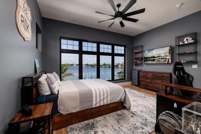 bedroom featuring ceiling fan and wood finished floors