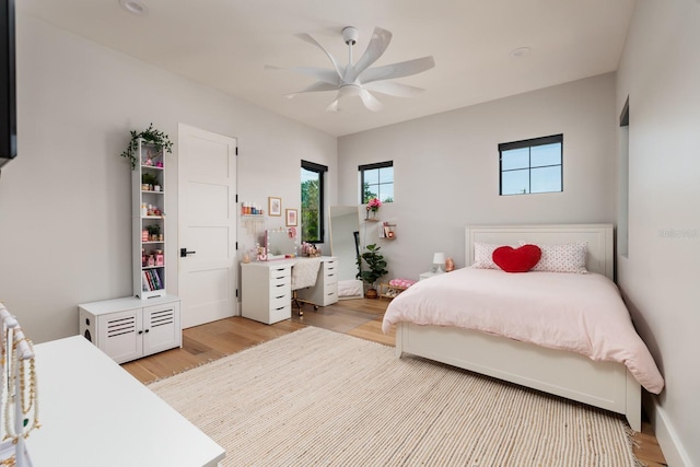 bedroom with ceiling fan and light wood finished floors