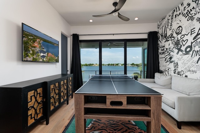 rec room with wood finished floors, a ceiling fan, and recessed lighting