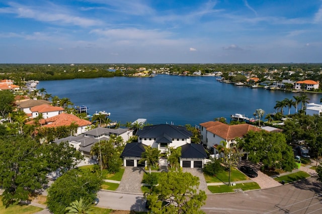 birds eye view of property with a residential view and a water view