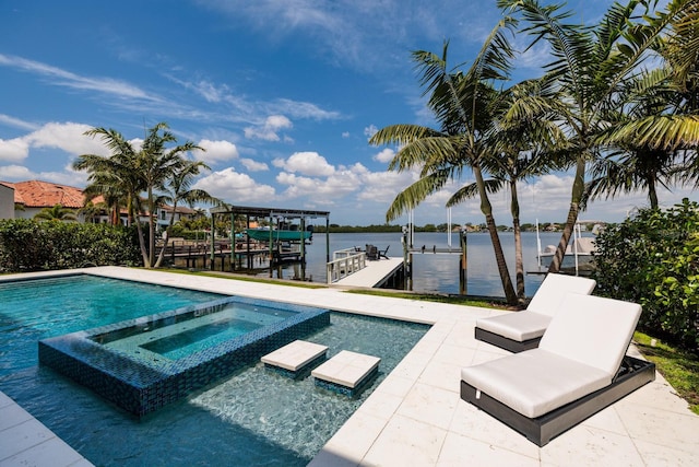 view of pool featuring a dock, a water view, a pool with connected hot tub, and boat lift