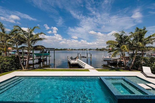 view of pool featuring a boat dock, a water view, boat lift, and a pool with connected hot tub
