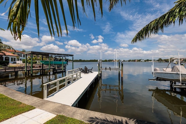 dock area with a water view and boat lift