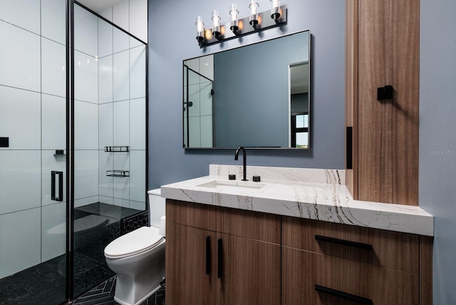 full bathroom featuring vanity, toilet, and a shower stall