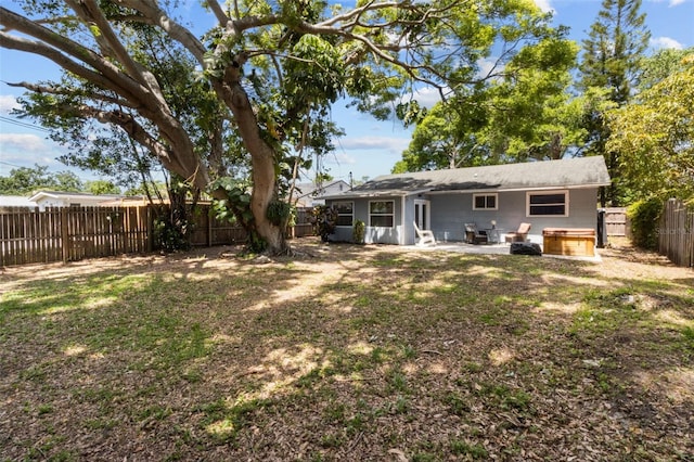 back of house featuring a patio area, entry steps, and a fenced backyard
