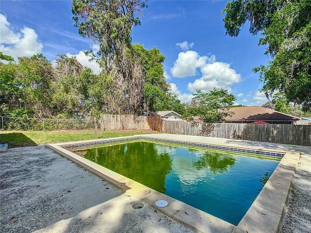 view of pool featuring a fenced backyard, a fenced in pool, and a patio