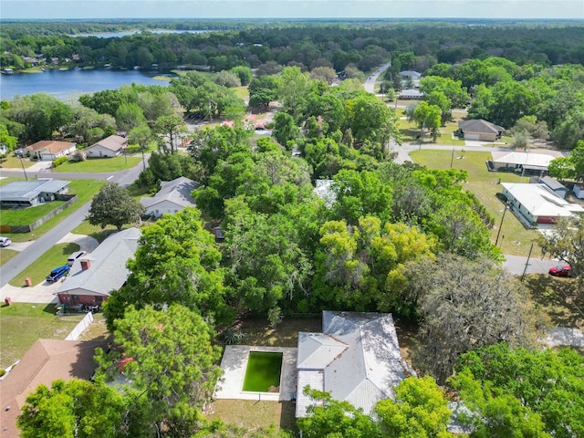aerial view with a residential view, a water view, and a forest view