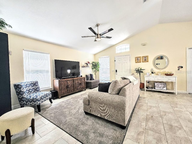 living area featuring a ceiling fan and vaulted ceiling