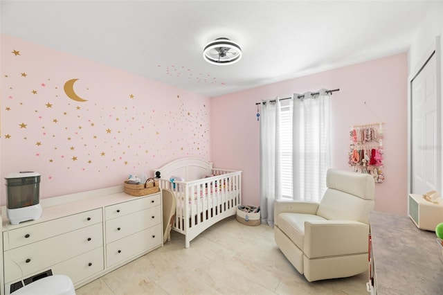bedroom featuring a crib