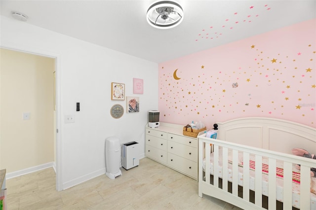 bedroom featuring a crib