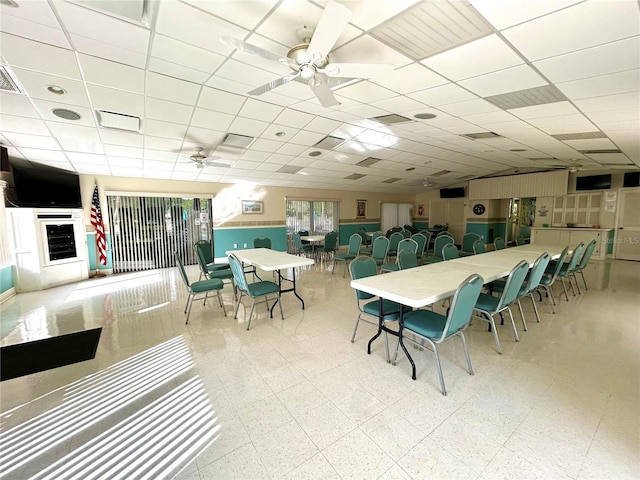 1423 Pine Glen Ln Unit D2, Tarpon Springs, FL 34688 - dining room featuring tile patterned floors, a paneled ceiling, and a ceiling fan
