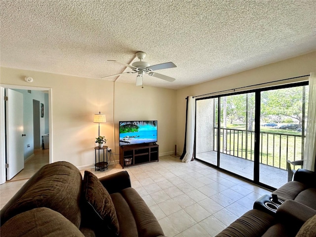 1423 Pine Glen Ln Unit D2, Tarpon Springs, FL 34688 - living area with a ceiling fan, light tile patterned flooring, and a textured ceiling