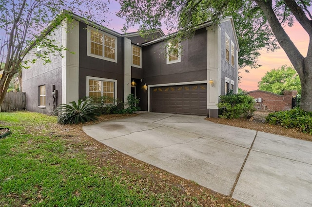 1300 Holly Glen Run, Apopka, FL 32703 - view of front of home with driveway, fence, a garage, and stucco siding