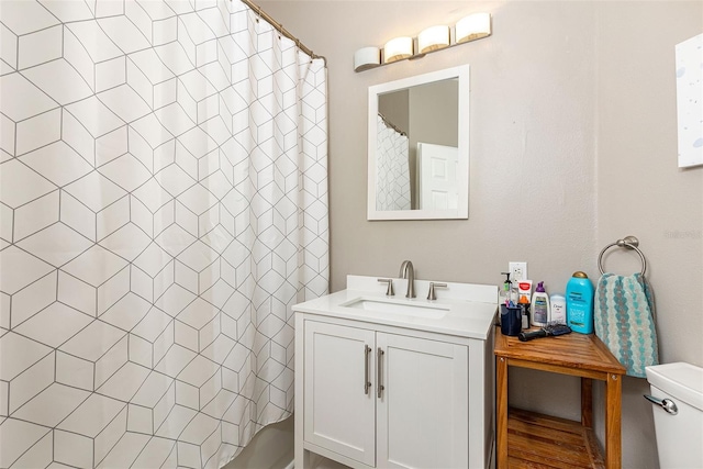 232 Columbia Dr, Tampa, FL 33606 - bathroom featuring vanity, a shower with shower curtain, and toilet