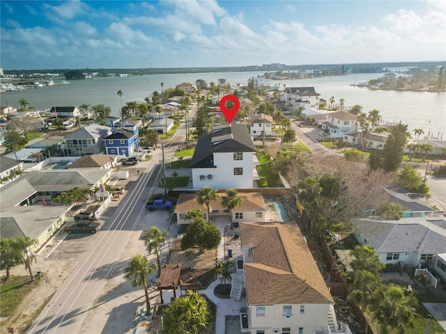 drone / aerial view featuring a residential view and a water view