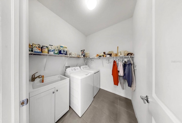 laundry area featuring independent washer and dryer, cabinet space, a sink, and tile patterned flooring