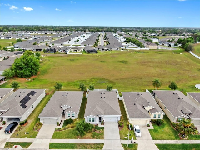 birds eye view of property with a residential view