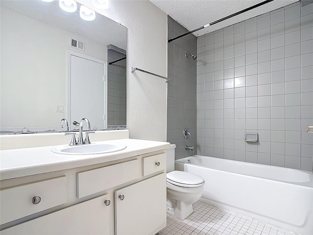 bathroom featuring toilet, a textured ceiling, tile patterned floors, visible vents, and shower / bathtub combination