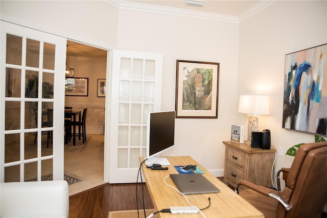 home office with a notable chandelier, dark wood-style flooring, visible vents, and ornamental molding