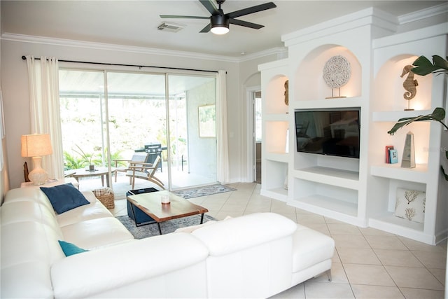 living room featuring ornamental molding, light tile patterned floors, a ceiling fan, visible vents, and built in shelves