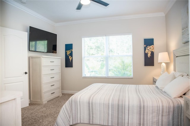 bedroom featuring ornamental molding, baseboards, a ceiling fan, and light carpet