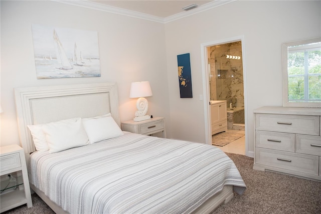 bedroom with ensuite bathroom, visible vents, ornamental molding, and carpet floors