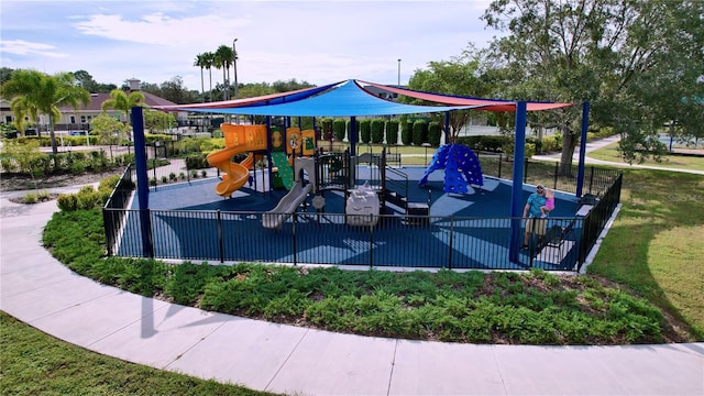 community jungle gym featuring fence