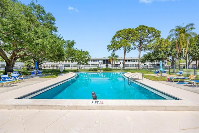 1000 79th Ave N Unit 211, Saint Petersburg, FL 33702 - community pool featuring fence and a patio area