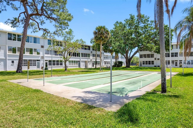 1000 79th Ave N Unit 211, Saint Petersburg, FL 33702 - view of home's community with a lawn and shuffleboard