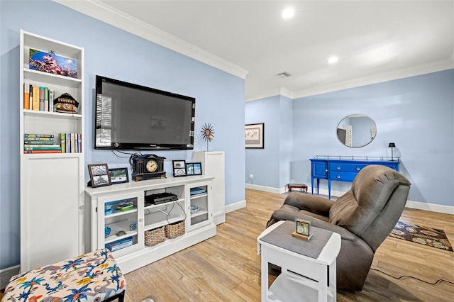 2623 57th St S, Gulfport, FL 33707 - living room with ornamental molding, visible vents, baseboards, and wood finished floors
