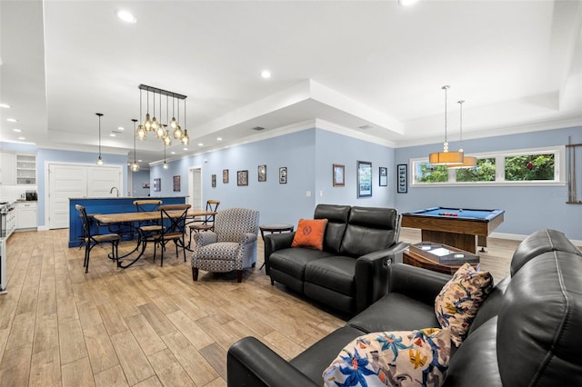 2623 57th St S, Gulfport, FL 33707 - living area featuring light wood-style flooring, billiards, crown molding, and a raised ceiling