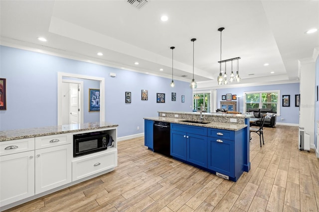 2623 57th St S, Gulfport, FL 33707 - kitchen featuring visible vents, a sink, a tray ceiling, black appliances, and light wood-style flooring