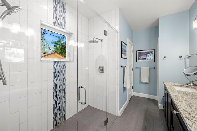 2623 57th St S, Gulfport, FL 33707 - full bath with a shower stall, vanity, and baseboards