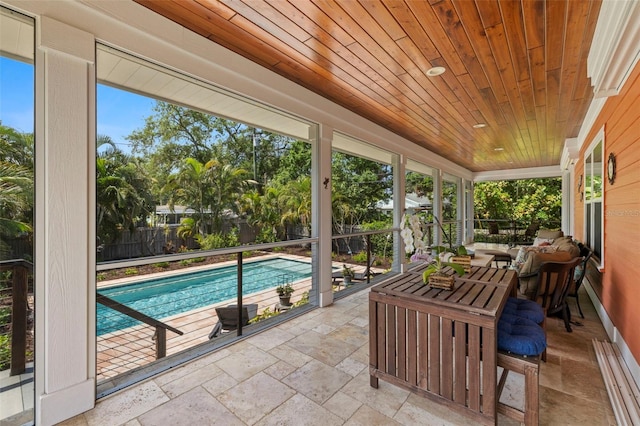2623 57th St S, Gulfport, FL 33707 - sunroom featuring wood ceiling and stone tile flooring