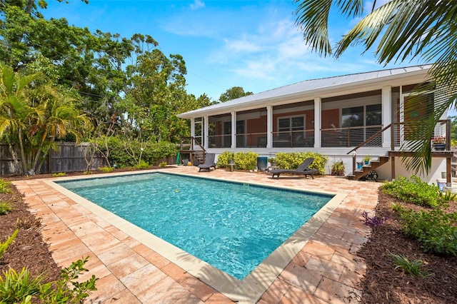 2623 57th St S, Gulfport, FL 33707 - view of swimming pool with fence, a patio, a sunroom, and a fenced in pool