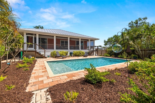 2623 57th St S, Gulfport, FL 33707 - view of pool with a fenced in pool, a patio, stairs, a sunroom, and fence