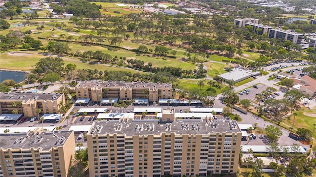drone / aerial view featuring a water view and golf course view