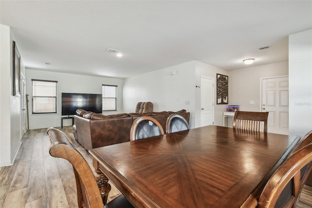 dining room featuring visible vents and light wood finished floors