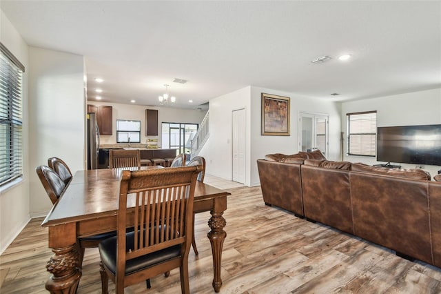 dining space featuring stairway, light wood-type flooring, visible vents, and recessed lighting